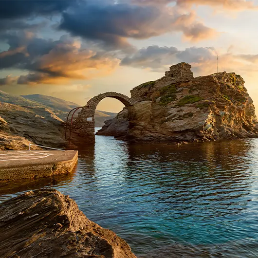 A scenic view of old arched stone bridge leading to the ancient Castle A scenic view of old arched stone bridge leading to the ancient Castle