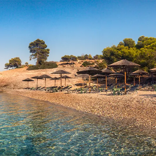 A scenic view of the Vrelos beach in Spetses Island A scenic view of the Vrelos beach in Spetses Island