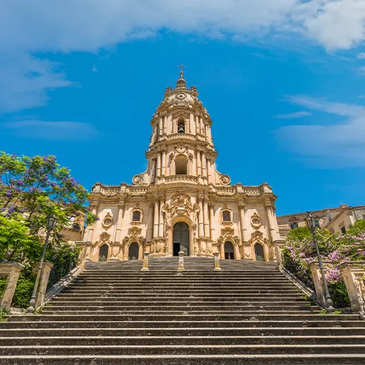 A scenic view of Duomo of San Giorgio in Modica A scenic view of Duomo of San Giorgio in Modica