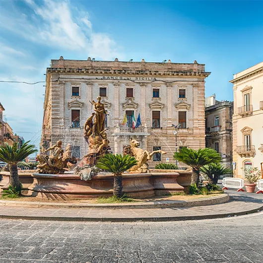 A scenic view of the scenic Fountain of Diana on the Ortygia Island A scenic view of the scenic Fountain of Diana on the Ortygia Island
