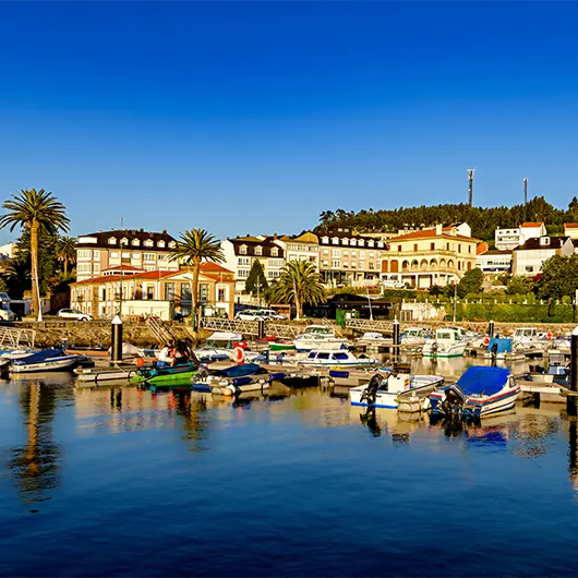 A Scenic View of colorful coastal town and marina of Ortigueira in Galicia A Scenic View of colorful coastal town and marina of Ortigueira in Galicia