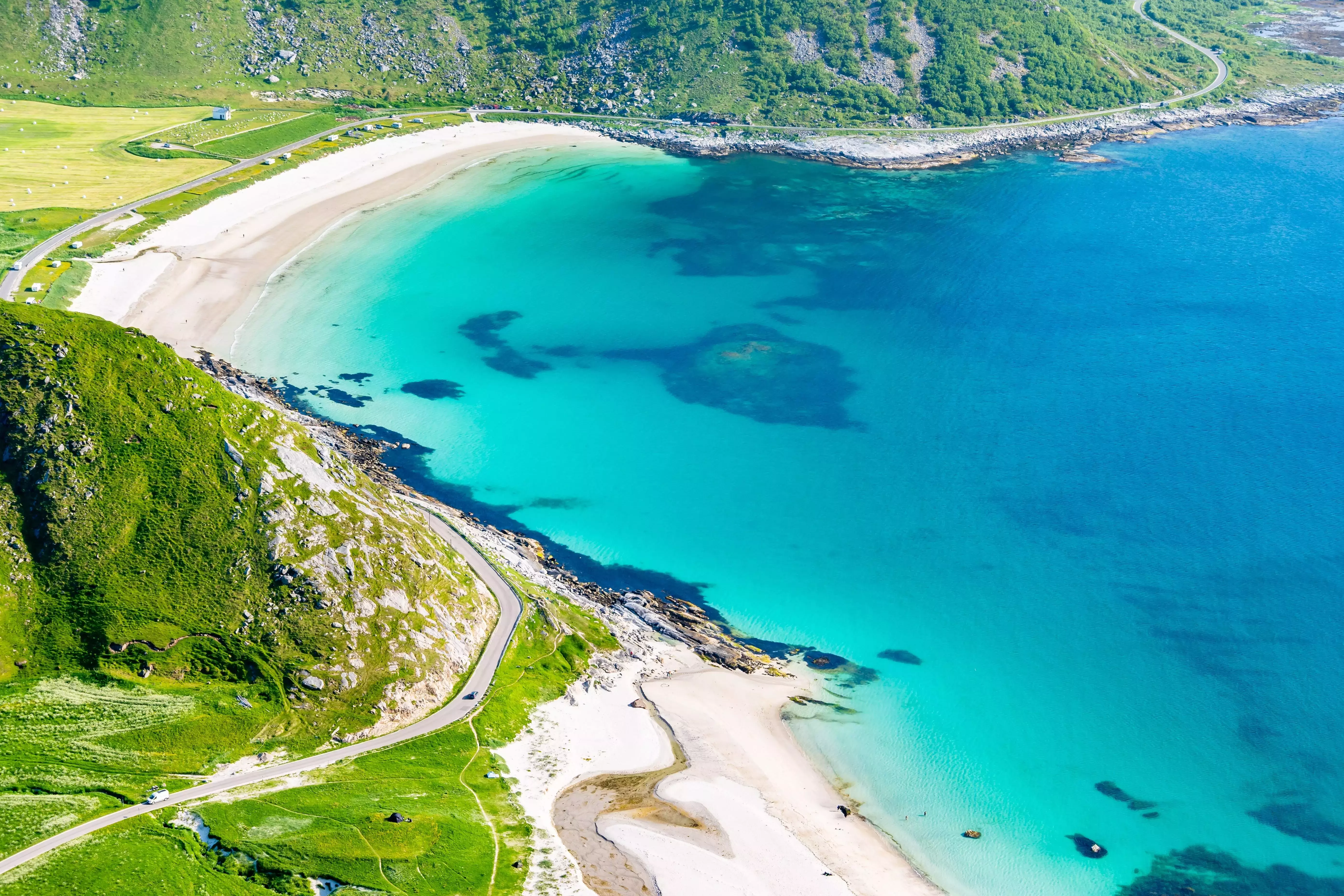 See the Midnight Sun and the Polar Night at Haukland Beach, Norway.