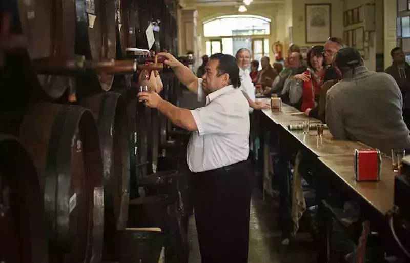 Serving Spanish Wine in Wooden Barrels
