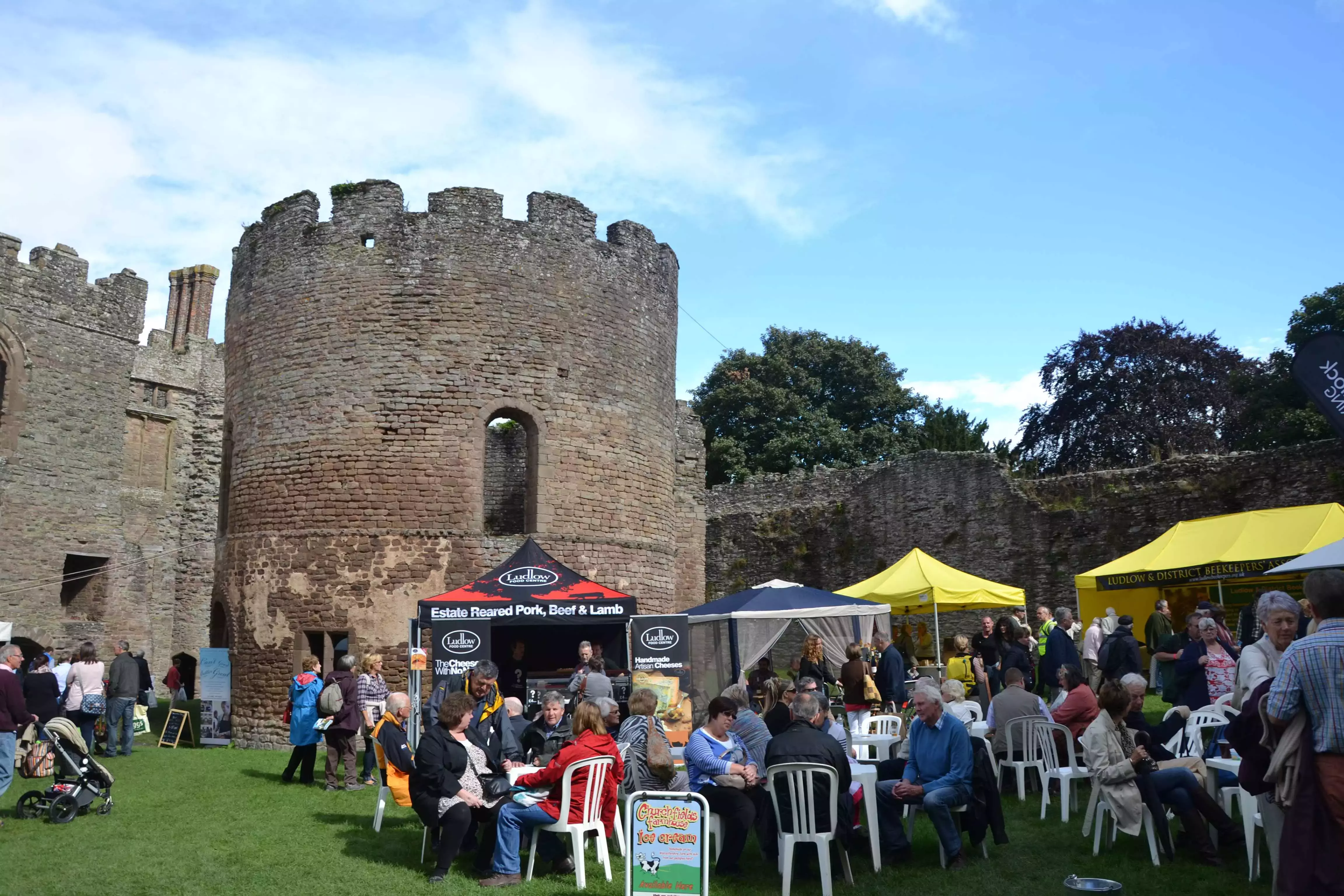 Food stalls in front of the historic Ludlow Castle at the Ludlow Food Festival in Shropshire.