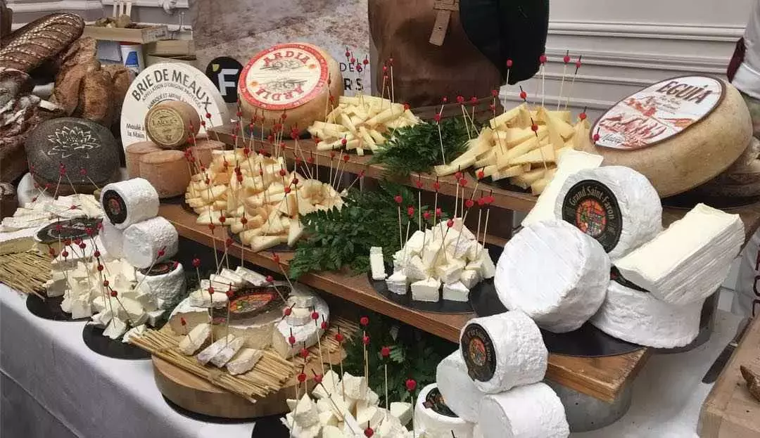 Artisan cheeses on display at the Fete de la Gastronomie in France.