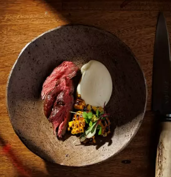 Fine dining presentation of steak at Fogon Asado, Buenos Aires