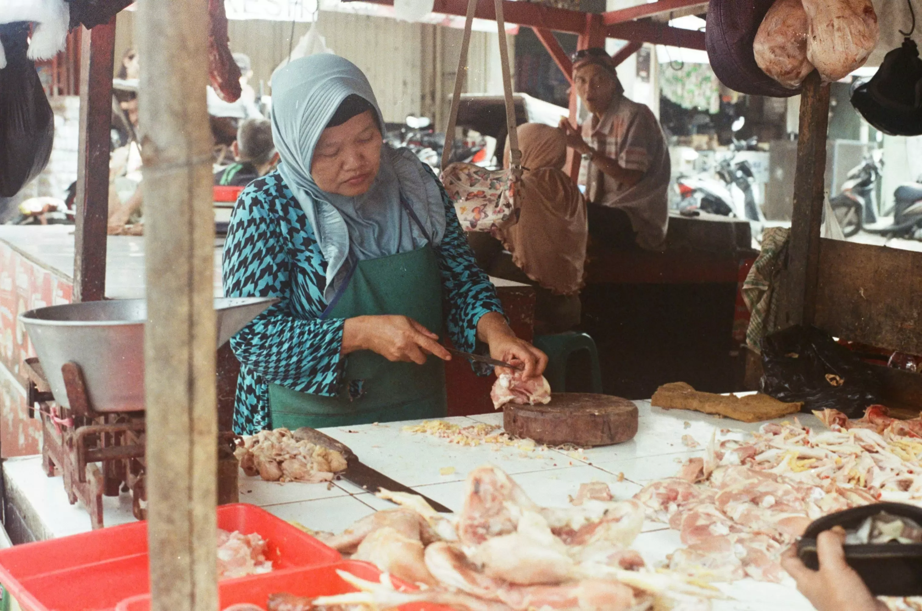 A vendor preparing fresh food at Ubud Market, Bali.