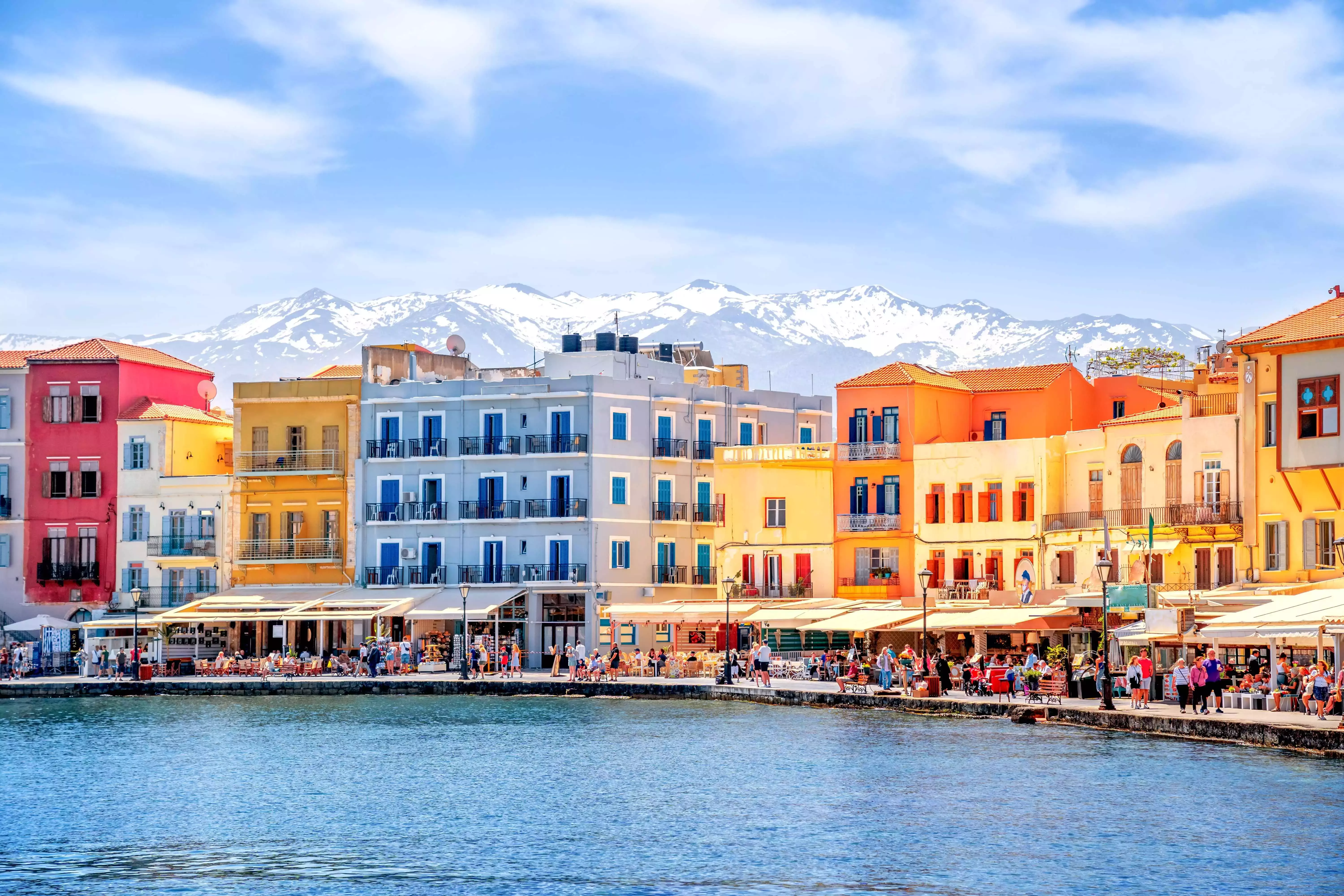 Colourful buildings with the White Mountains in the background in Crete, Greece.