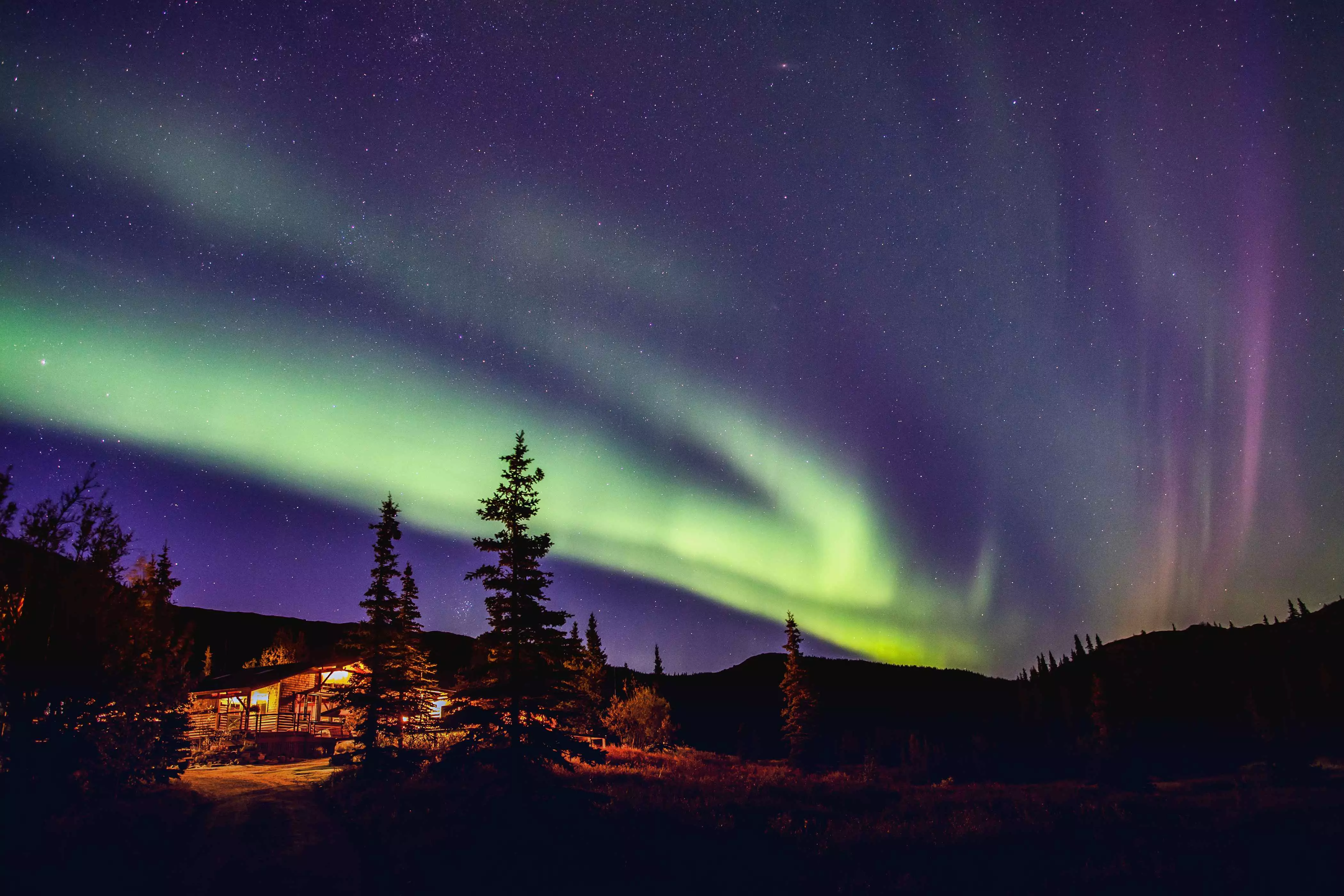 Northern Lights over remote cabin in Denali National Park, Alaska.