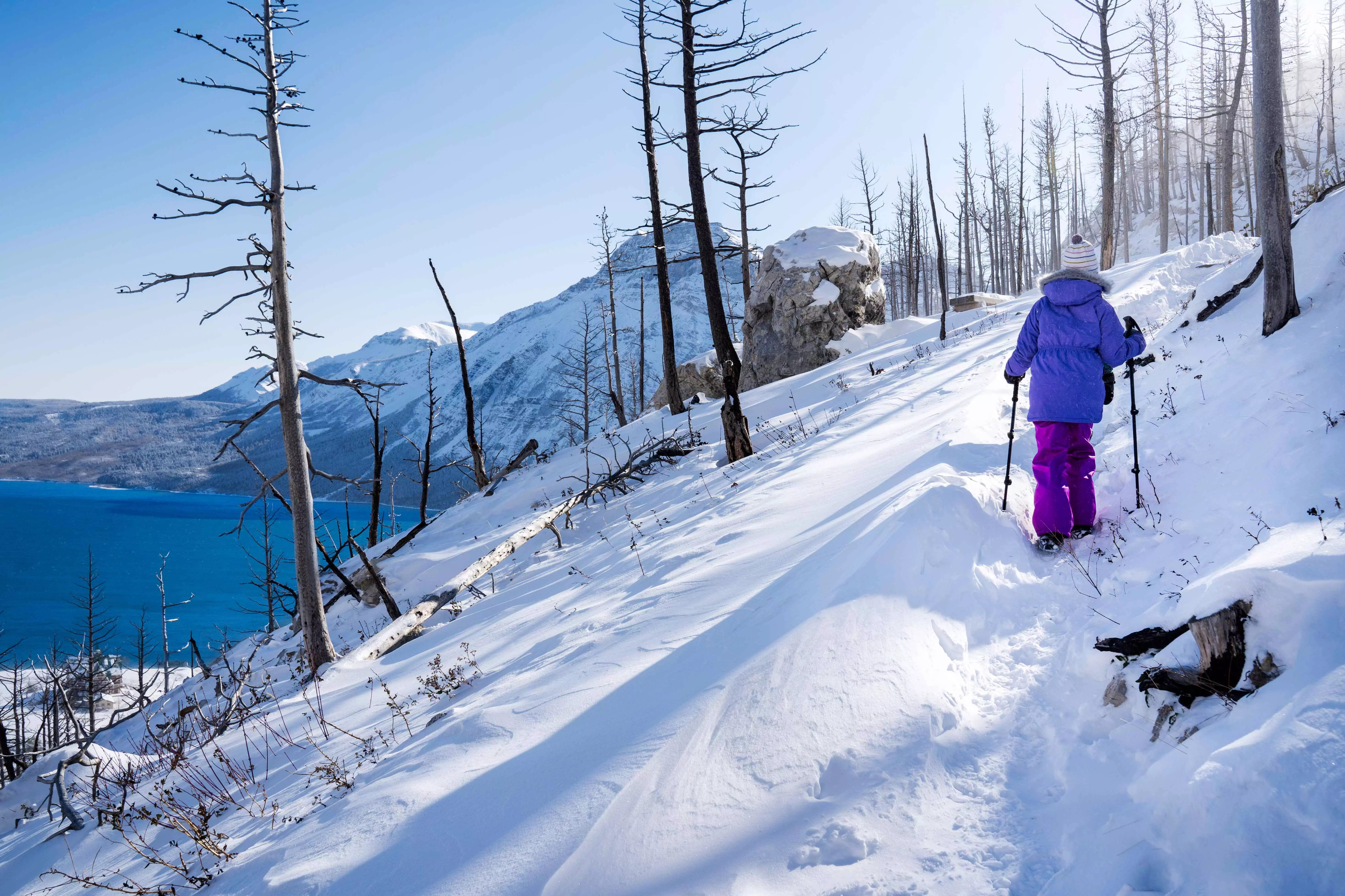 A tourist exploring the Canadian Rockies Mountain Range with snowshoes.