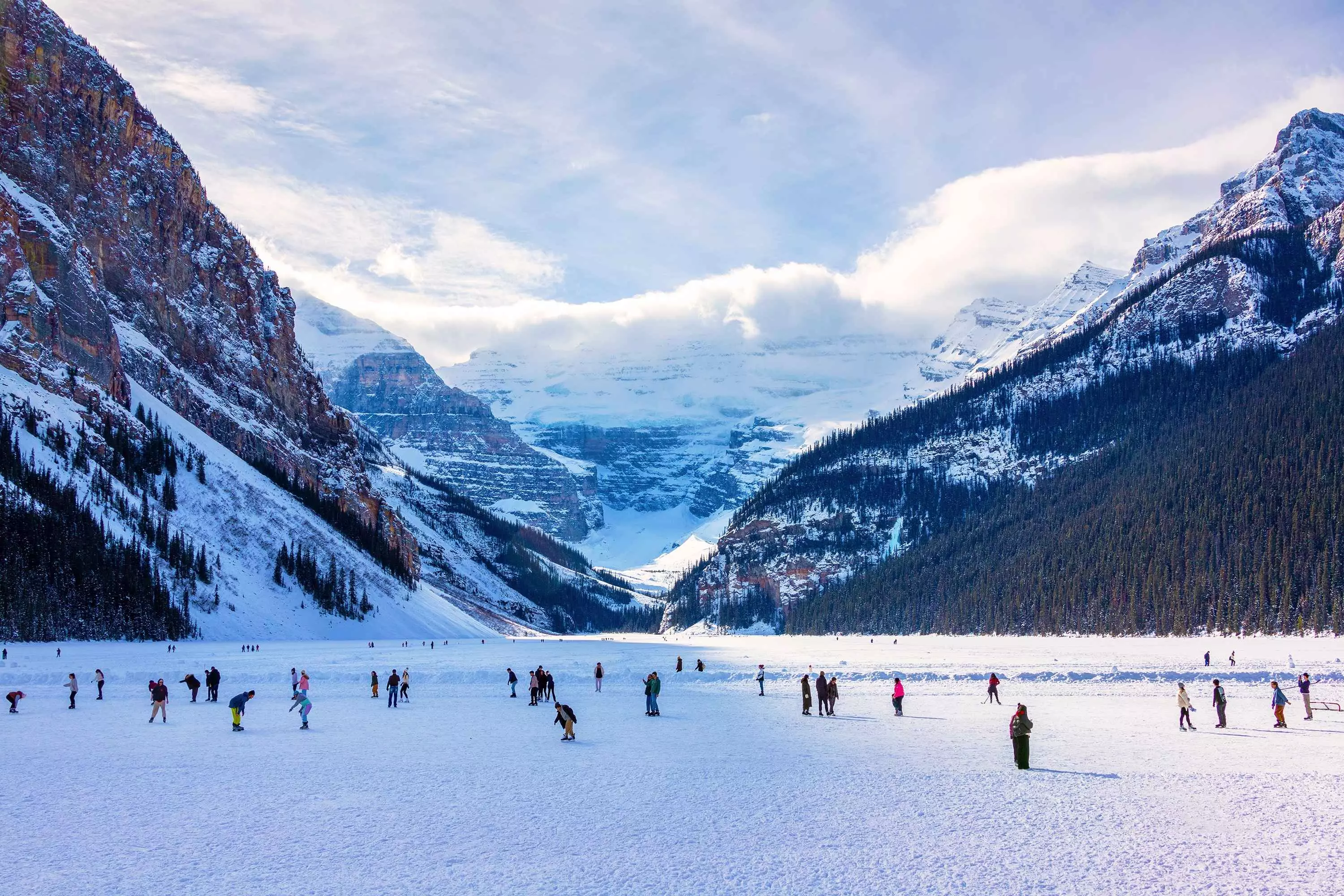 People skiing on Lake Louise in Alberta, Canada.