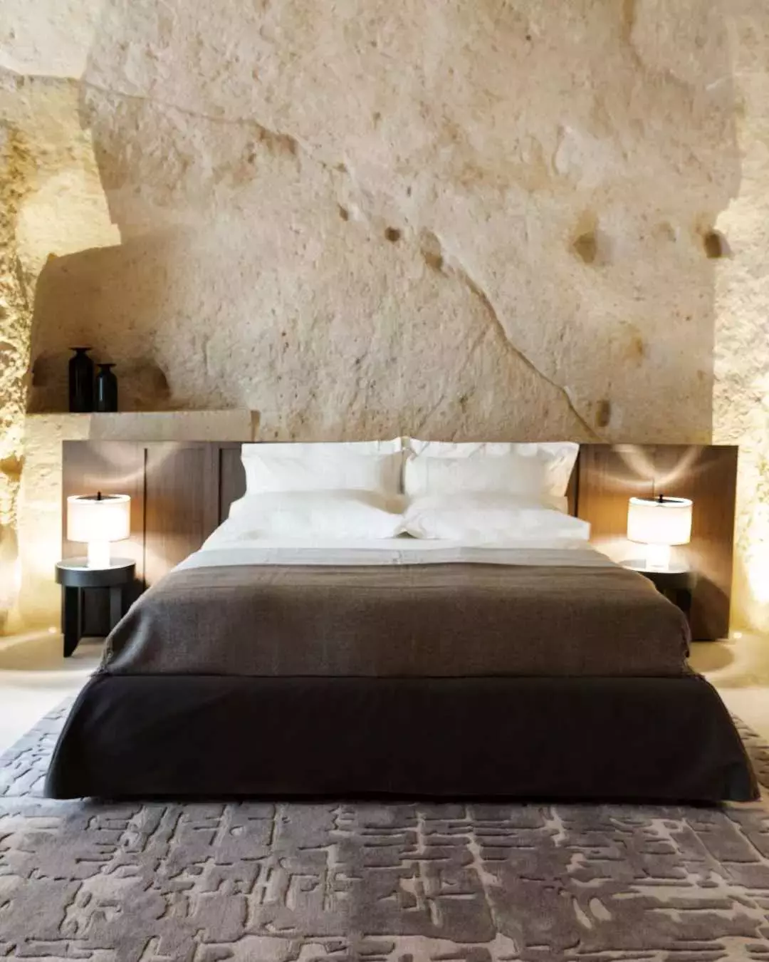 A bedroom in Vetera Matera Hotel in Matera, Italy.