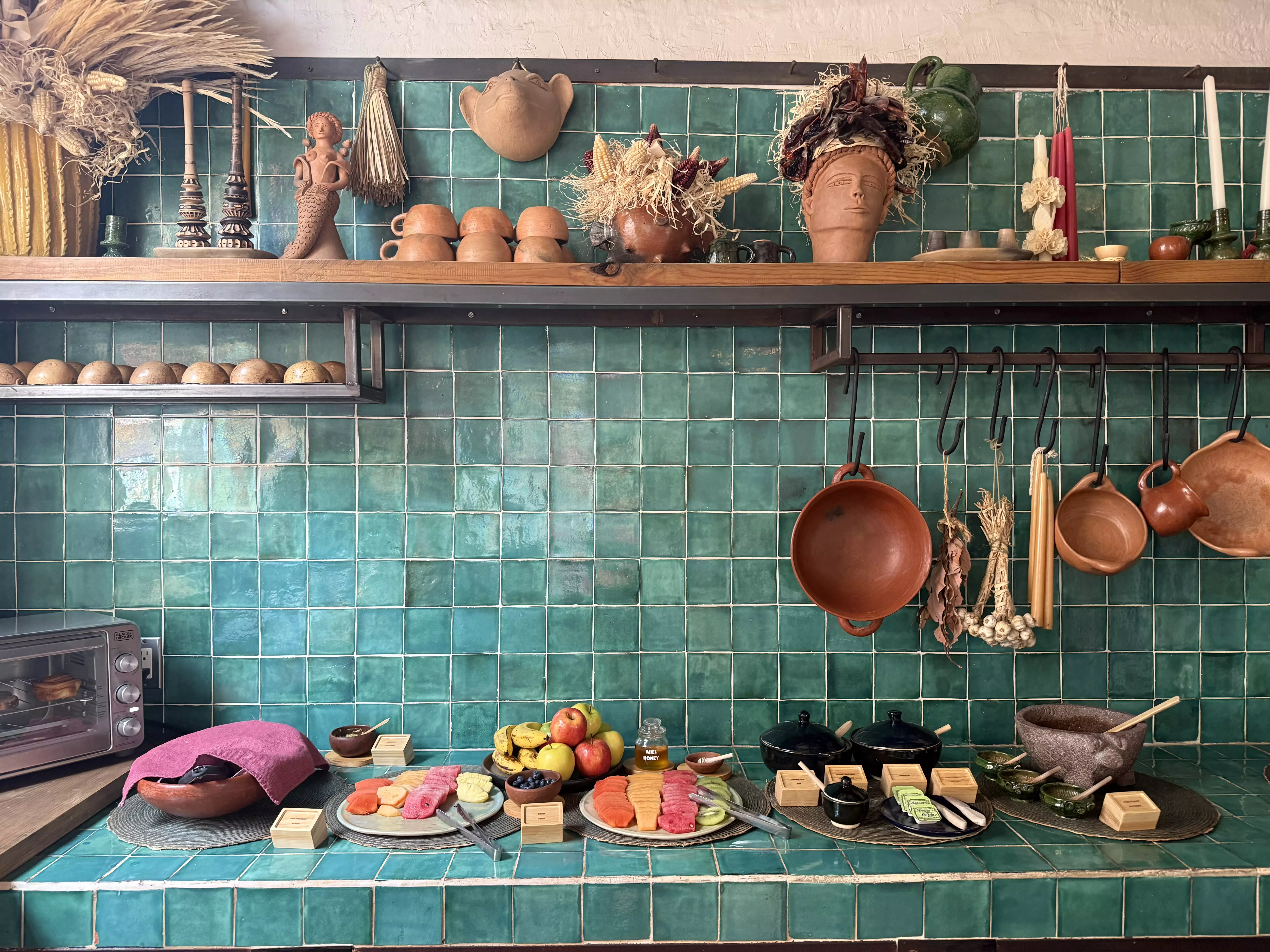 teal tiled kitchen at grana bnb