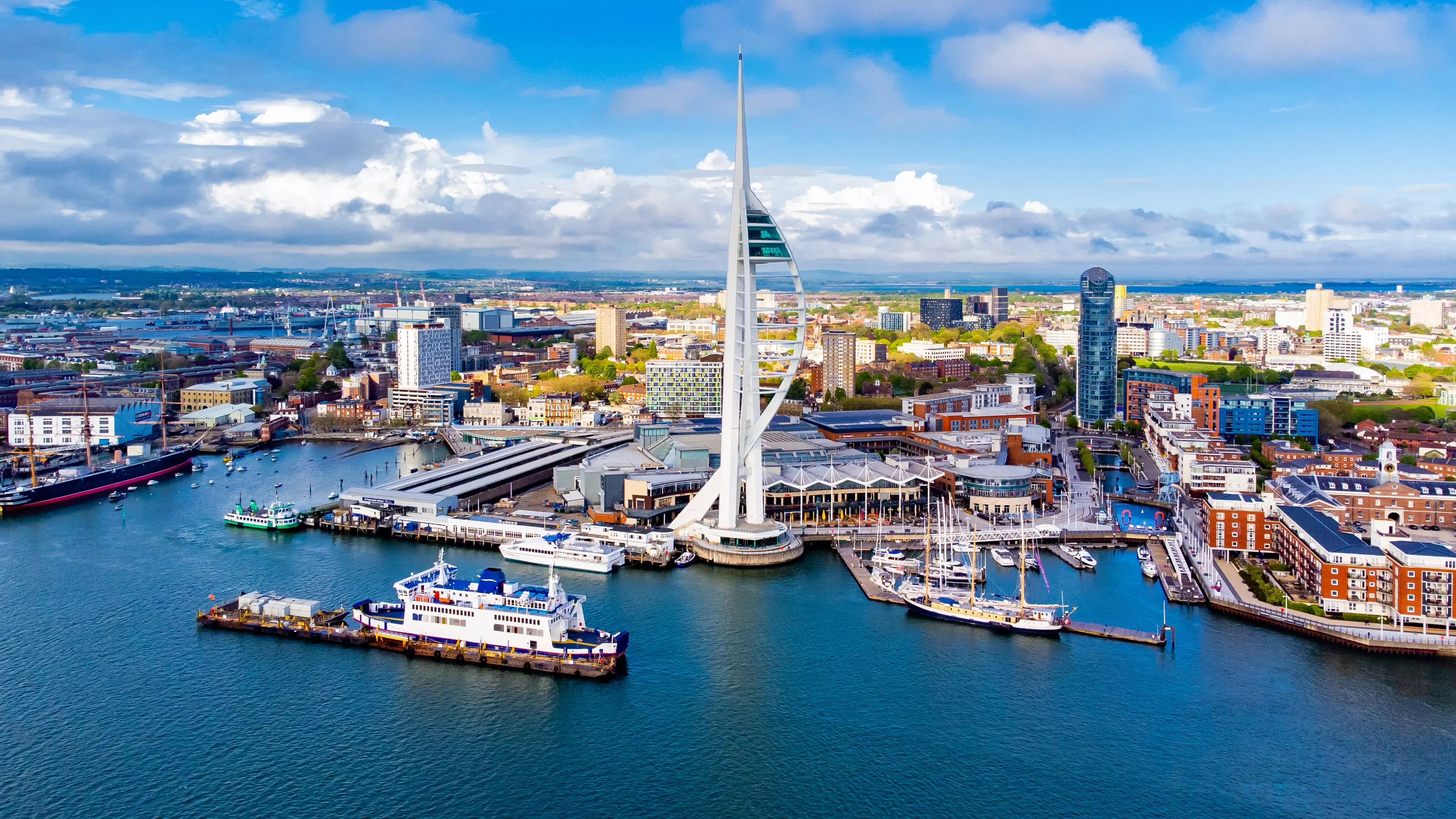 Aerial view of the sail-shaped Spinnaker Tower in Portsmouth Harbor in the south of England