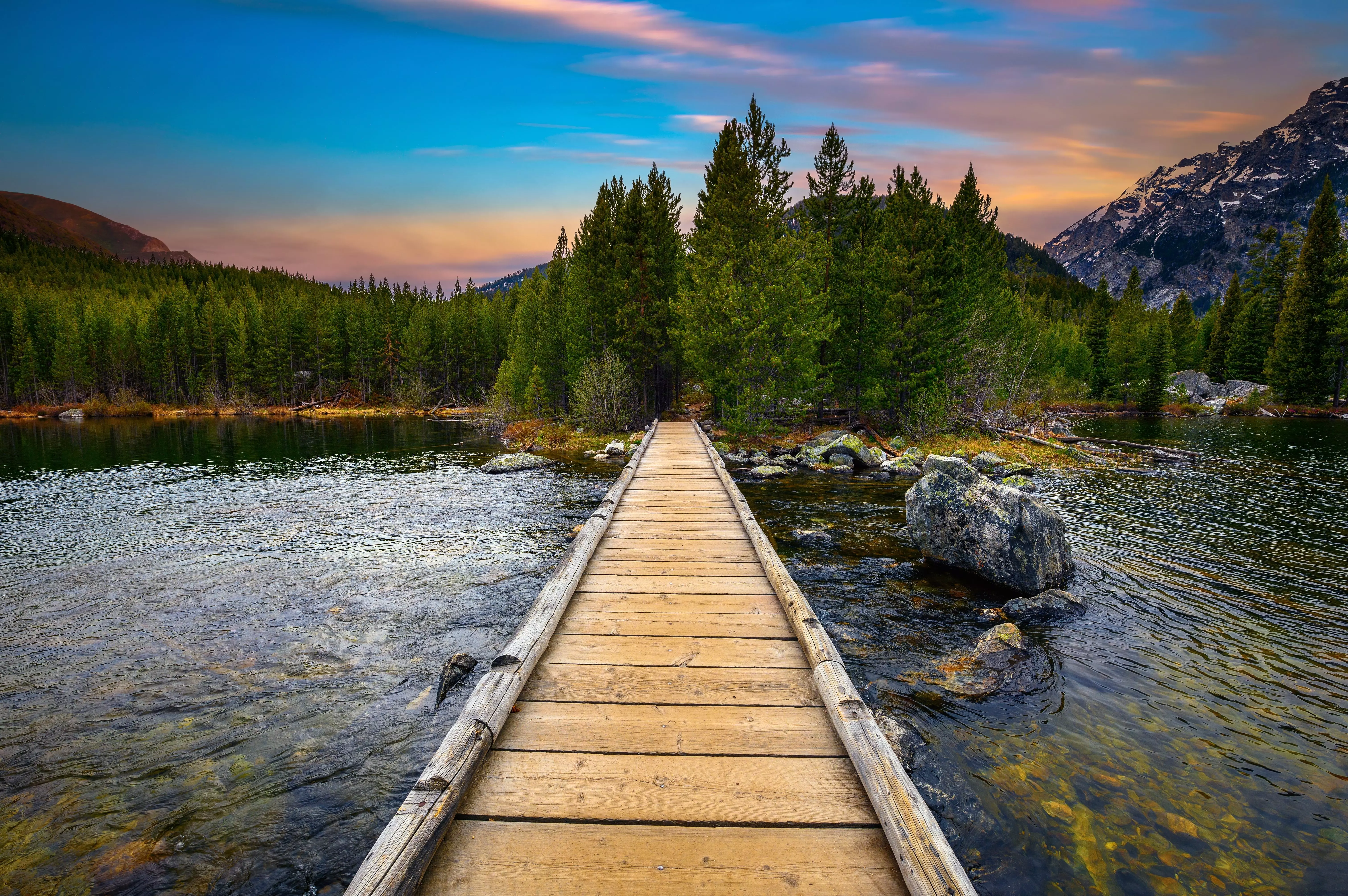 Enjoy a cool dip in the mountain-water filled lake in Wyoming, USA.