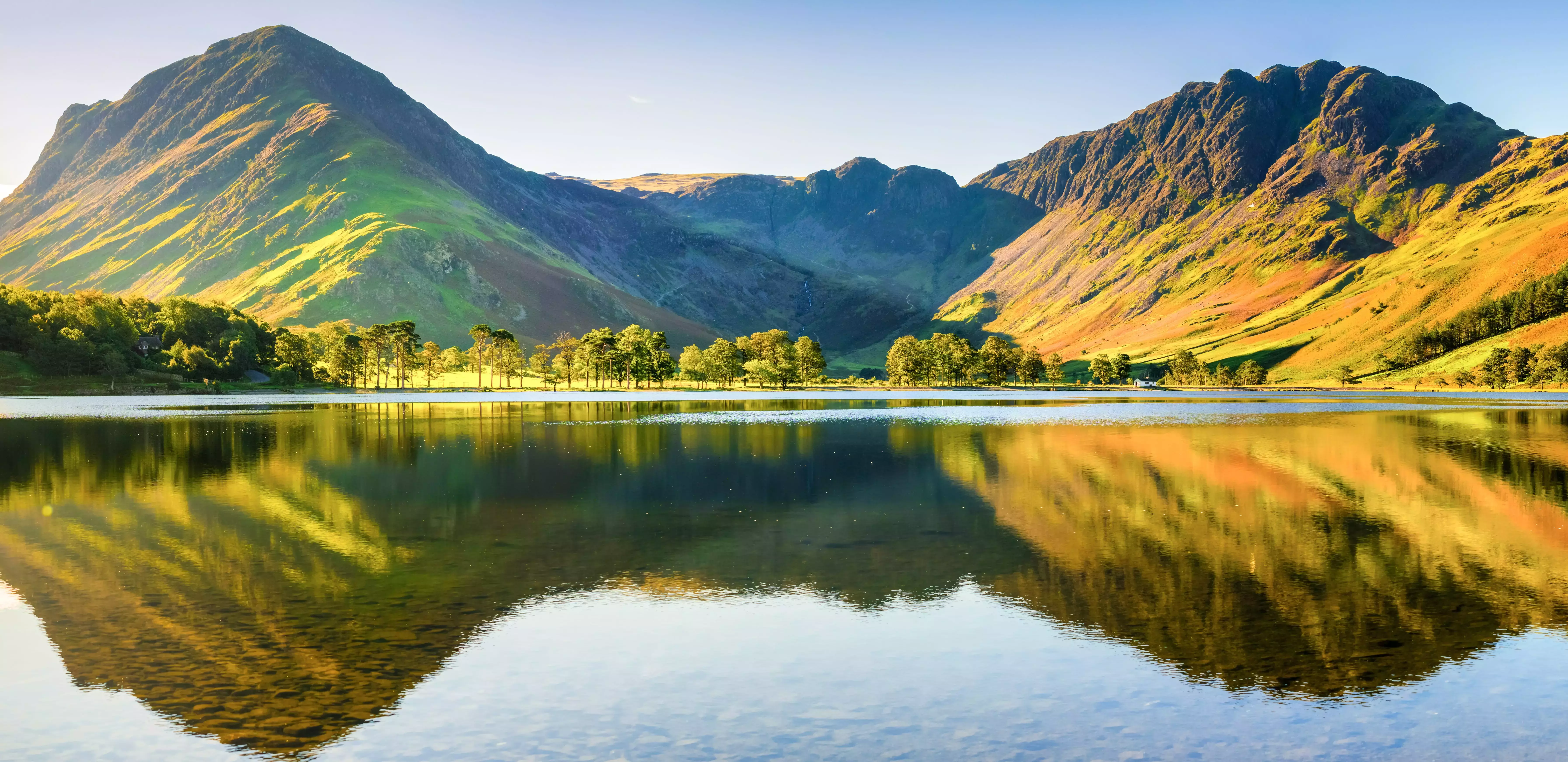Reflections of the sloping hills into Buttermere in the Lake District, England