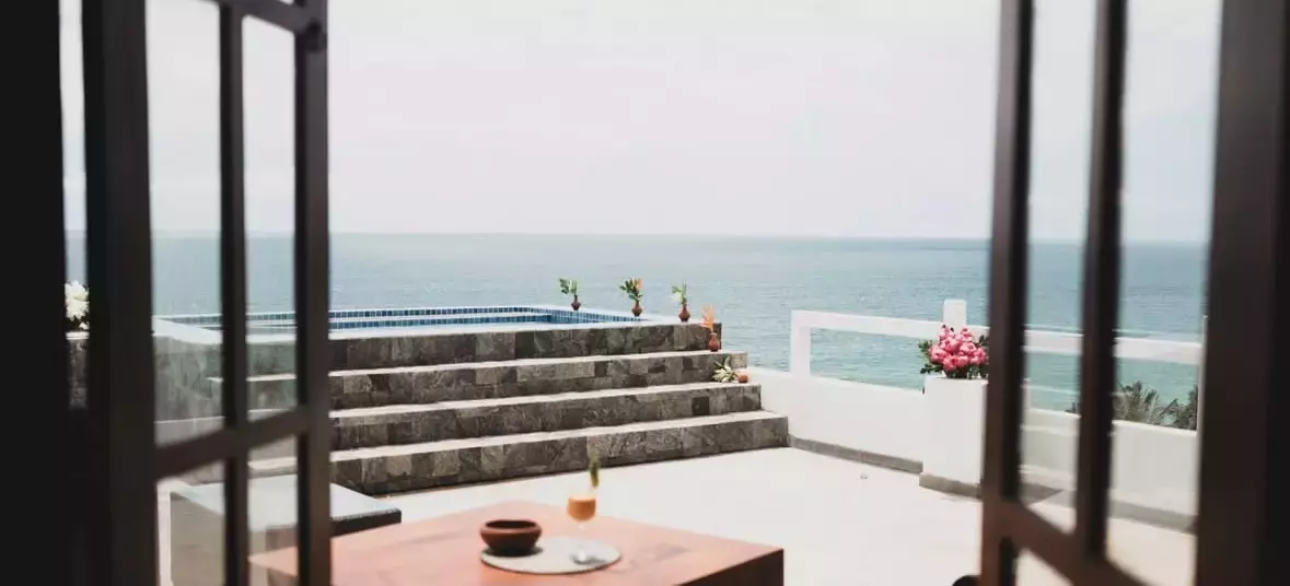 Beachside yoga is the order of the day at Barberyn Beach Resort.