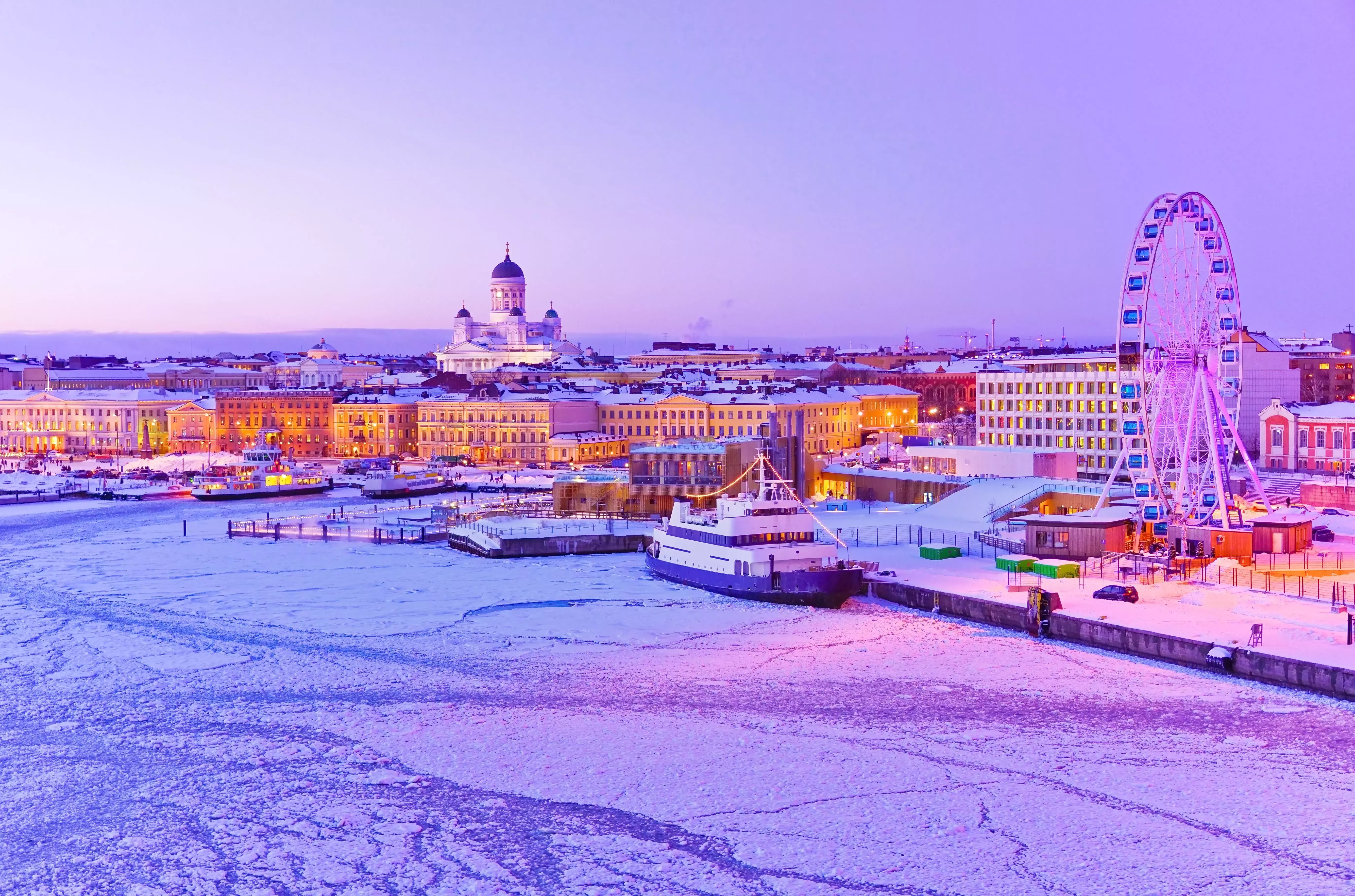 Helsinki&amp;amp;#039;s frozen harbour under a purple dusk sky.