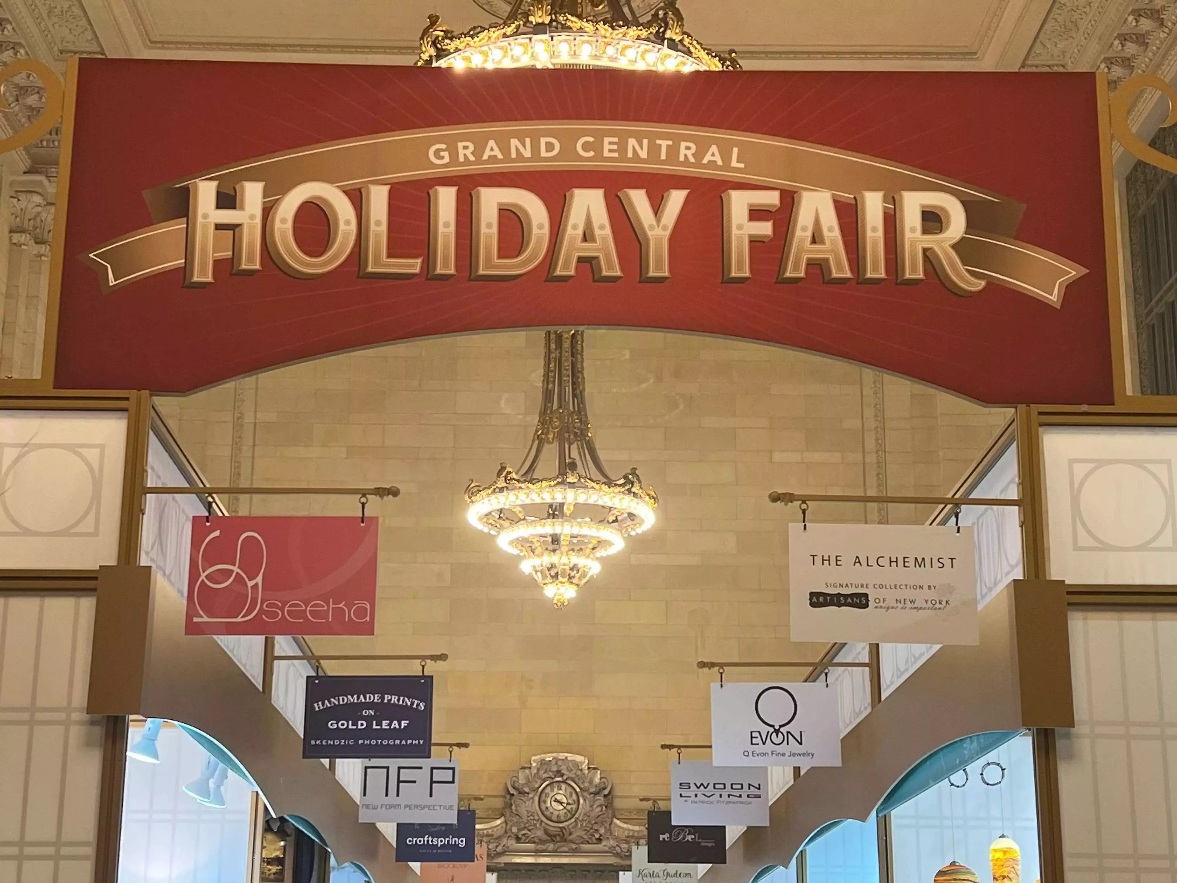 Store signs at the Grand Central Holiday Fair at Grand Central Station in New York City.