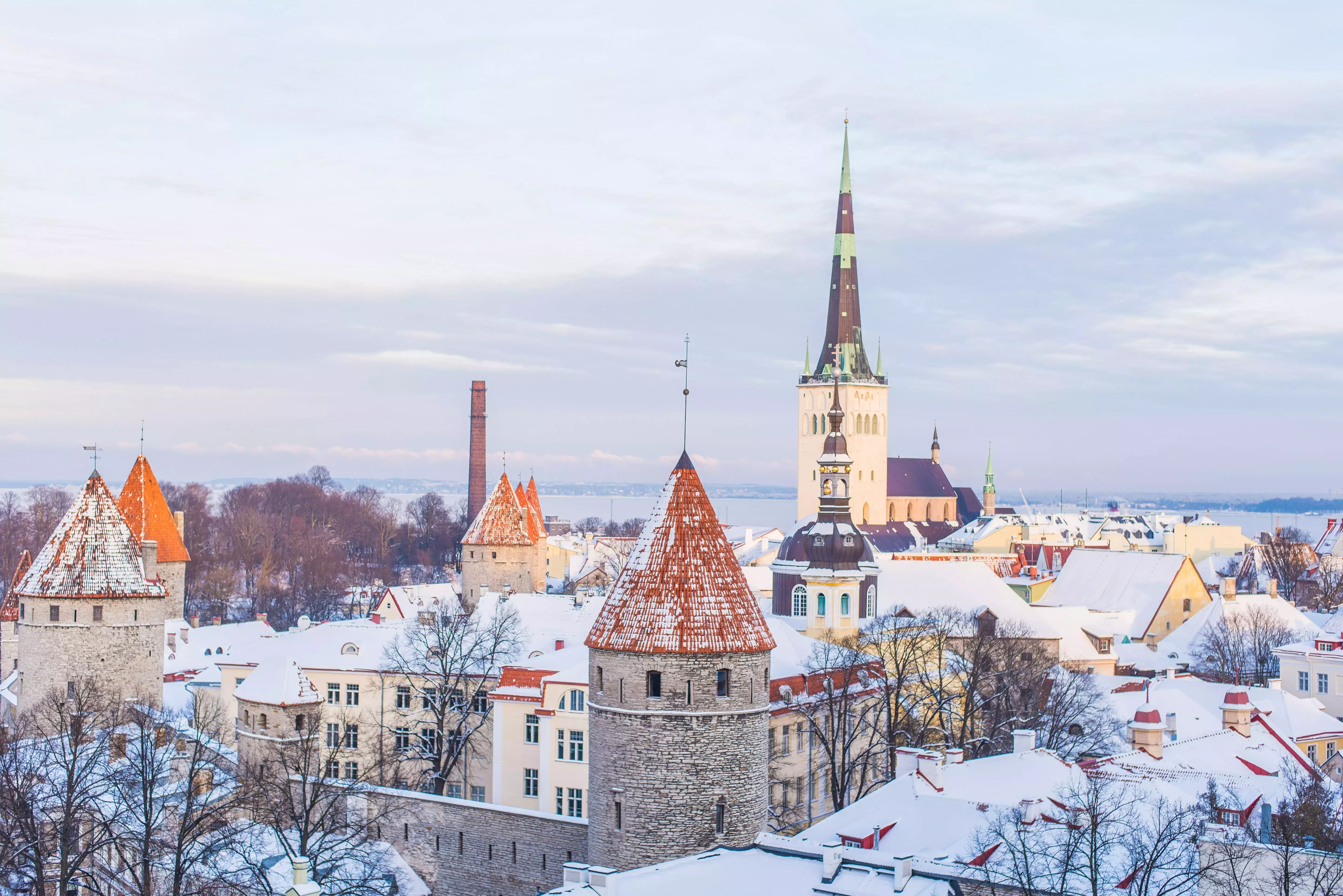 An aerial view of snow-capped buildings in Tallinn in winter.