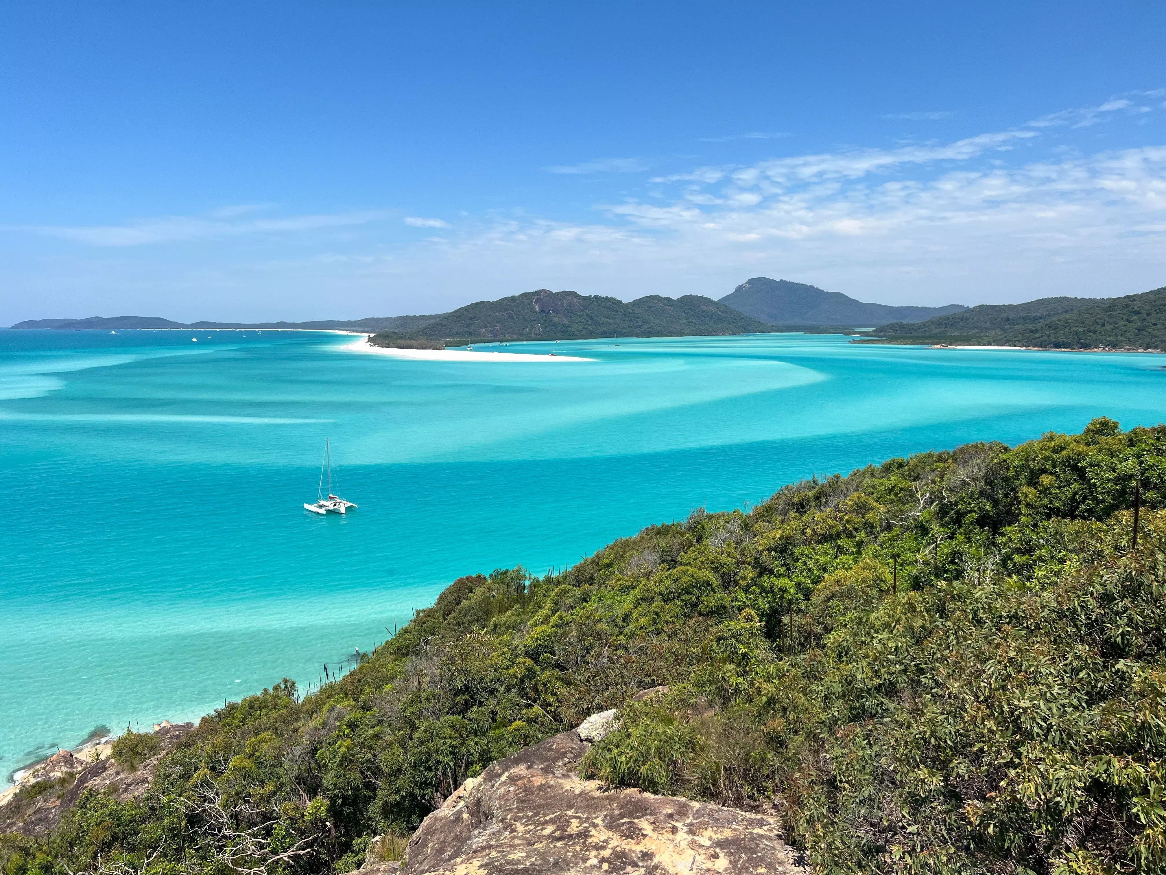 White-sand beaches and turquoise islands characterise Whitsunday Island, Australia.