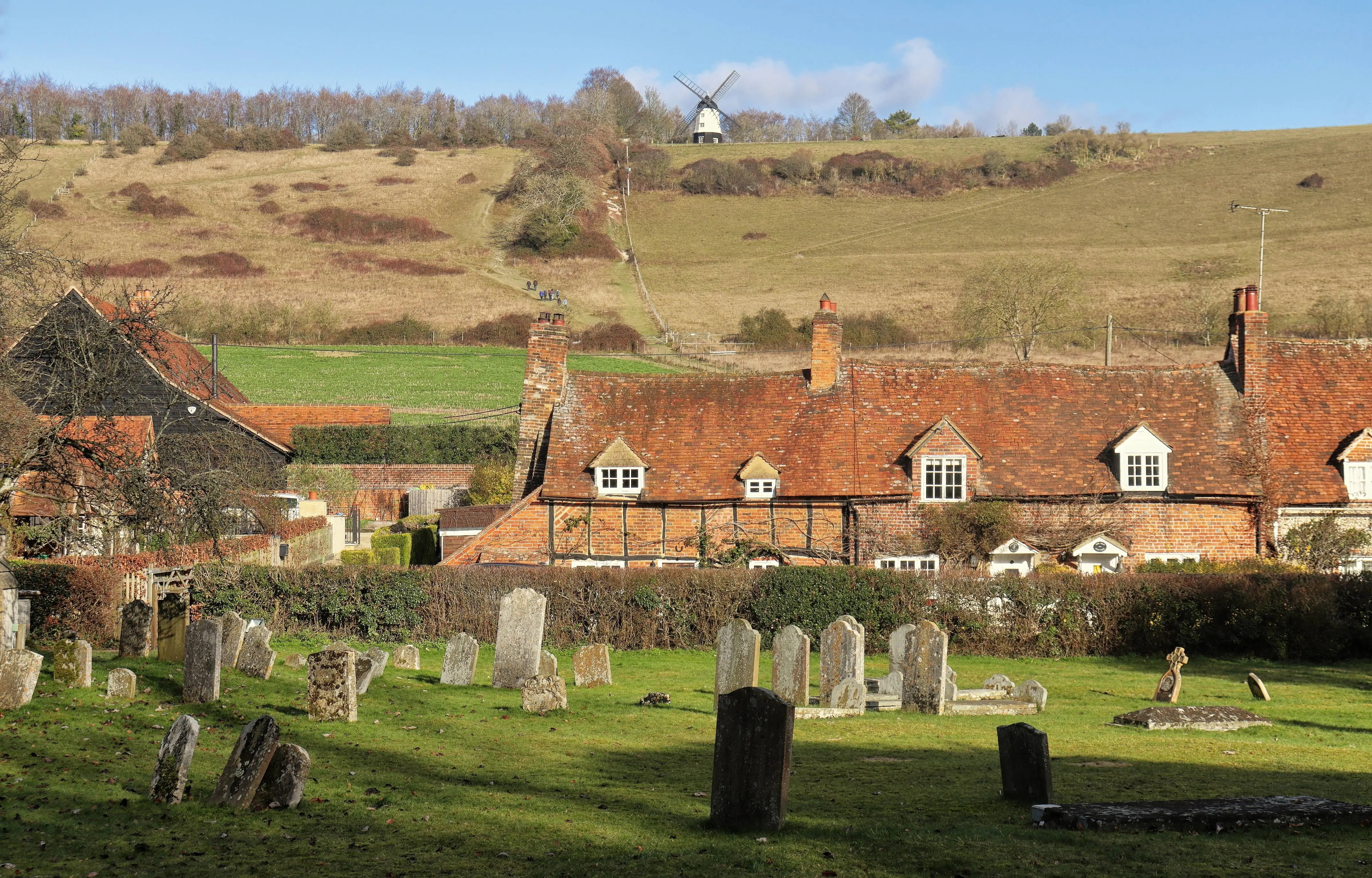 Traditional village cottages and rolling hills in Turville.
