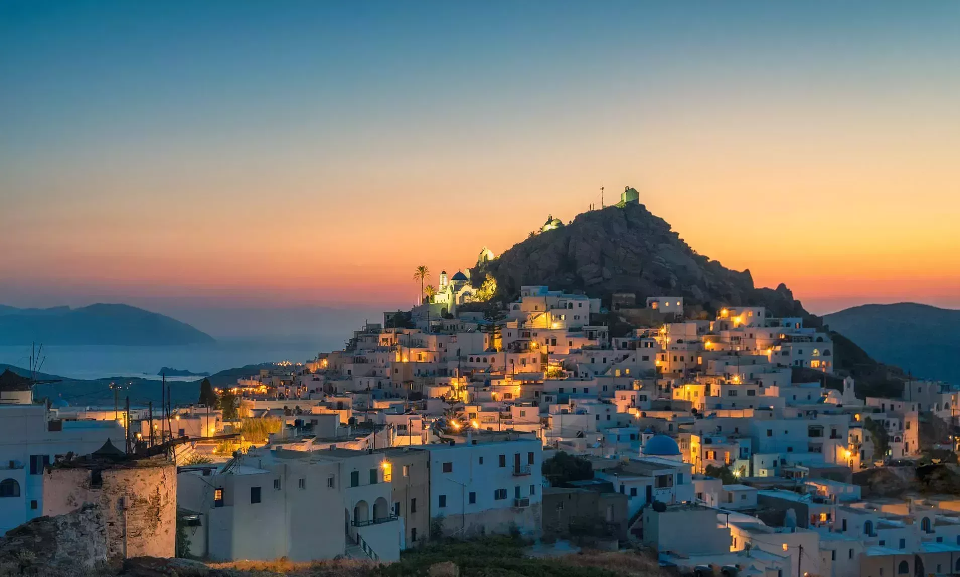 Ios town, Ios island, Greece - 05 31 2019: Famous pillow cafe on stairs at sunset time