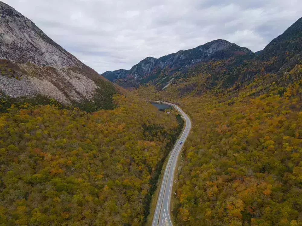 franconia notch lake with fall foliage