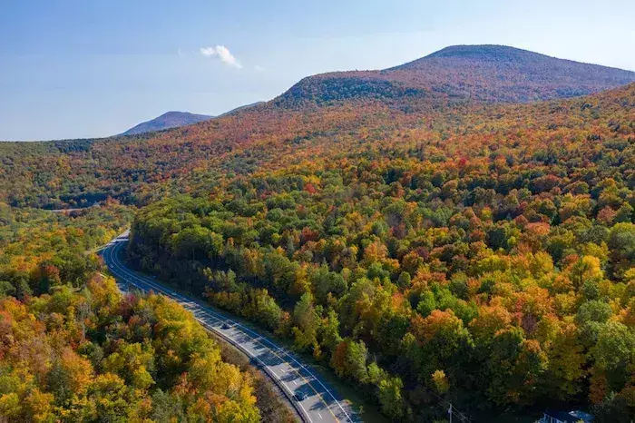 Aerial view of fall foliage along the Catskill Mountains in upstate New York along Five State Lookout.