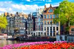 Panoramic view of the historic city center of Amsterdam. Traditional houses and bridges of Amsterdam.