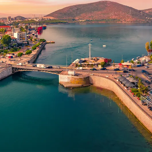 A scenic view of Chalcis town with Chalkida's Old Bridge
