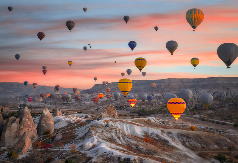 Scenic view of hot air balloons over Cappadocia