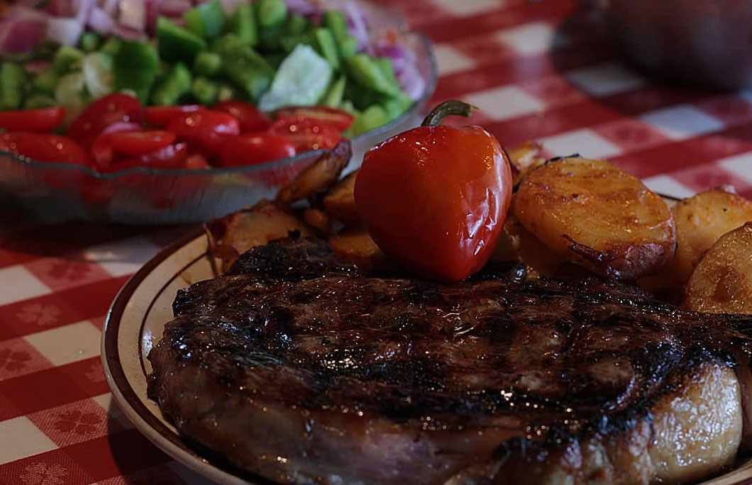 Best steakhouses new jersey arthur's tavern juicy steak on a plate with a salad
