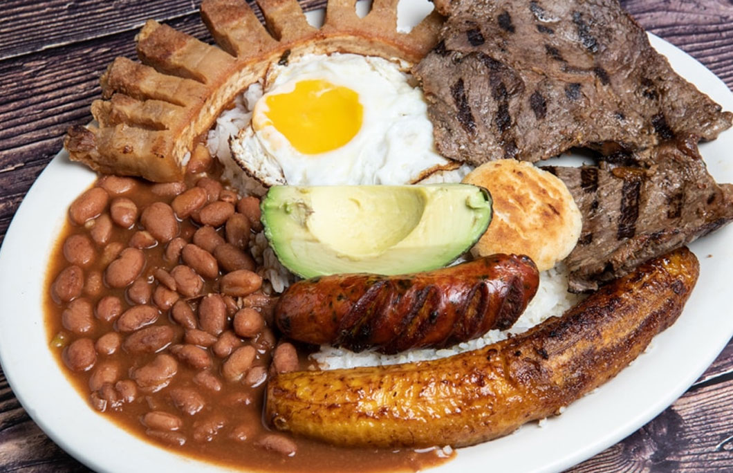 The 7 Best Colombian Food Dishes To Try Enjoy Travel   Best Colombian Food Dishes Bandeja Paisa 