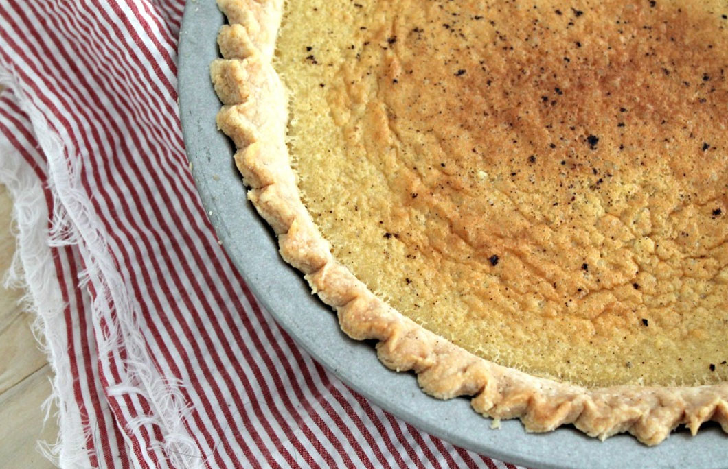 Brown Butter Buttermilk Pie - A classic buttermilk pie with the flavor of browned butter added in. Get this delicious dessert recipe from CookingWithBooks.com