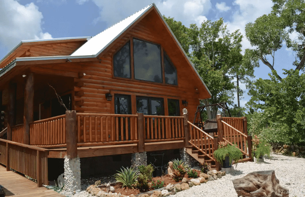 6. Country Charm Log Cabin- Clewiston