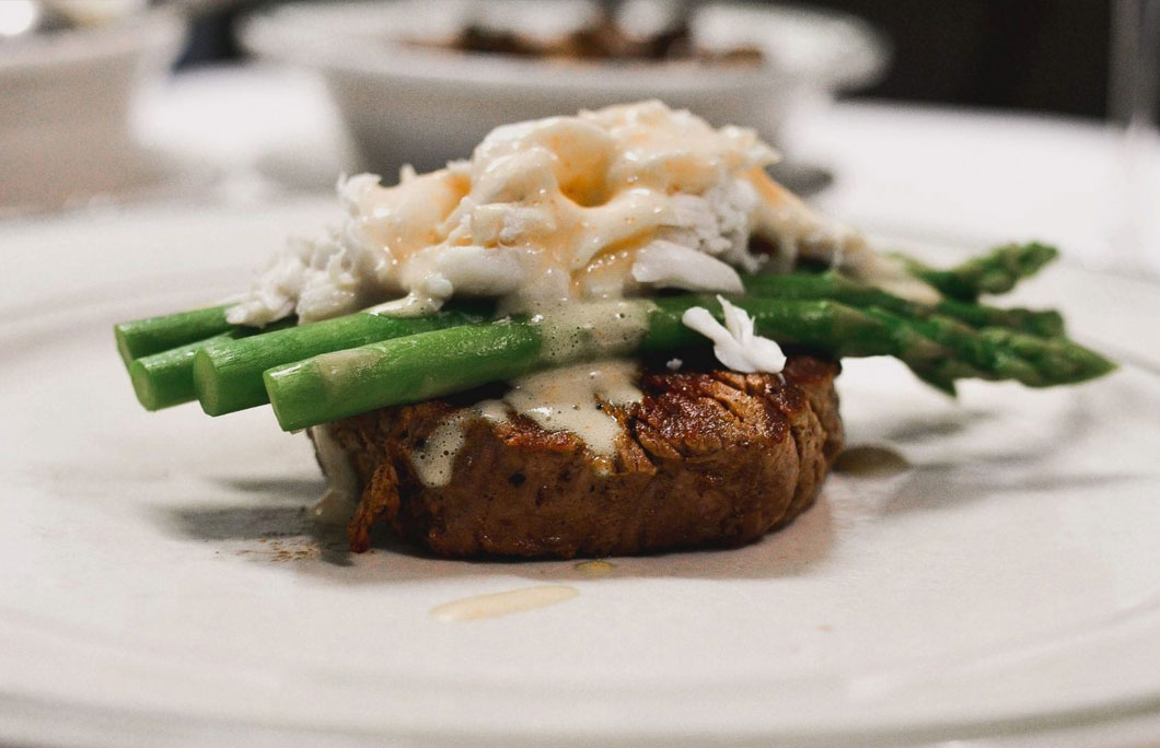 steak on a plate topped with lobster from Edward's Steakhouse New Jersey