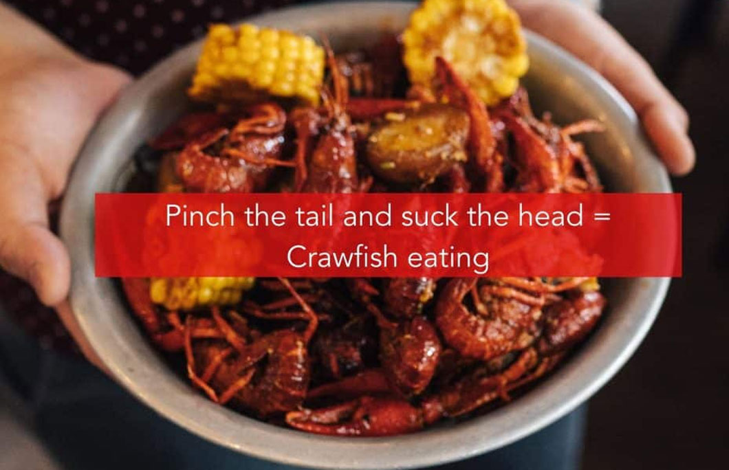 Pinch the tail and suck the head = Crawfish eating