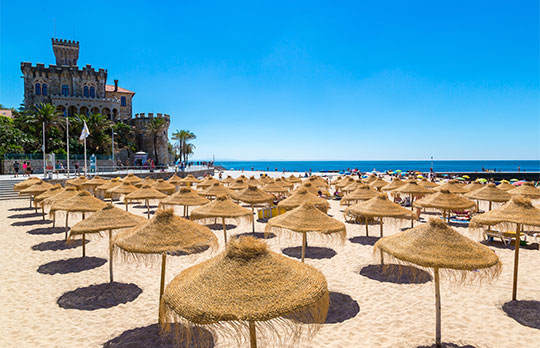 Umbrellas on public beach in Estoril